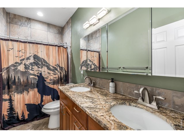 Property Photo 12 Second Full Bathroom & double vanity- Main Level