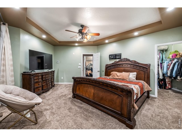 Property Photo 8 Primary Bedroom with custom crown ceilings