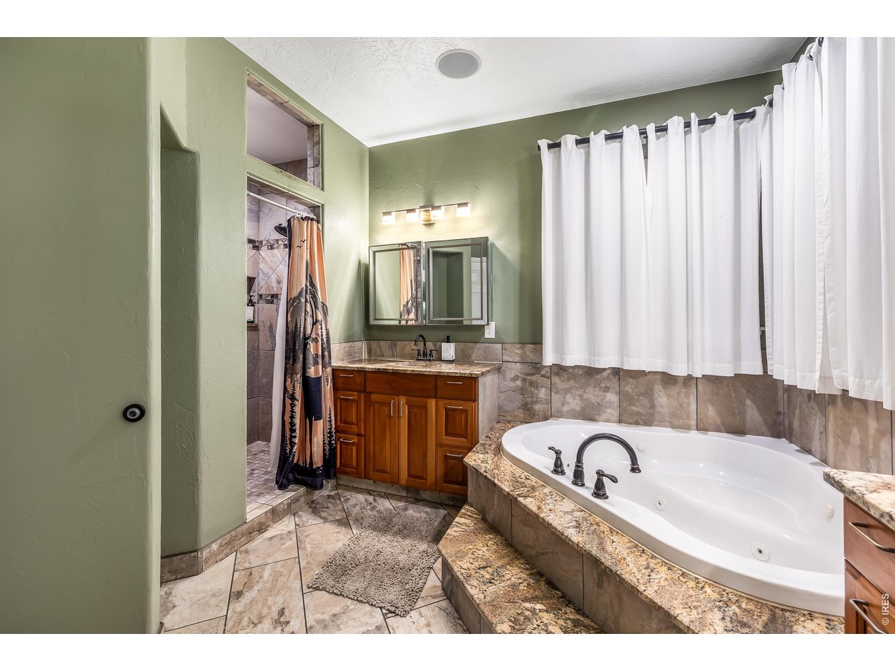 Jetted soaking bathtub & two separate vanity areas