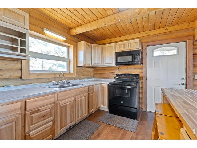 Property Photo 13 Corian Countertops and breakfast bar