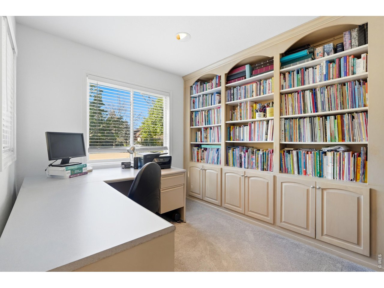 Home office with built-in bookcases.