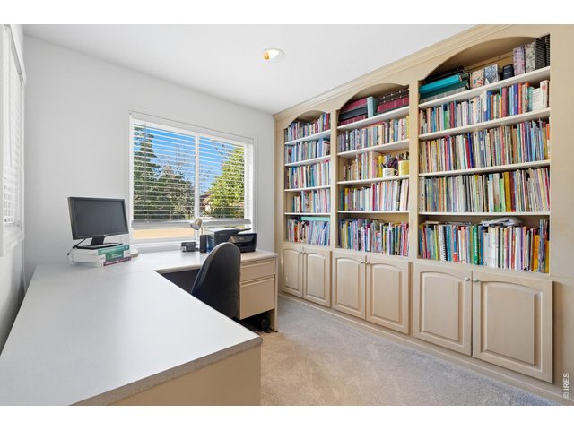 Property Photo 9 Home office with built-in bookcases.