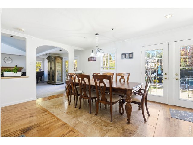 Property Photo 8 Open dining room with French doors to the back yard. 