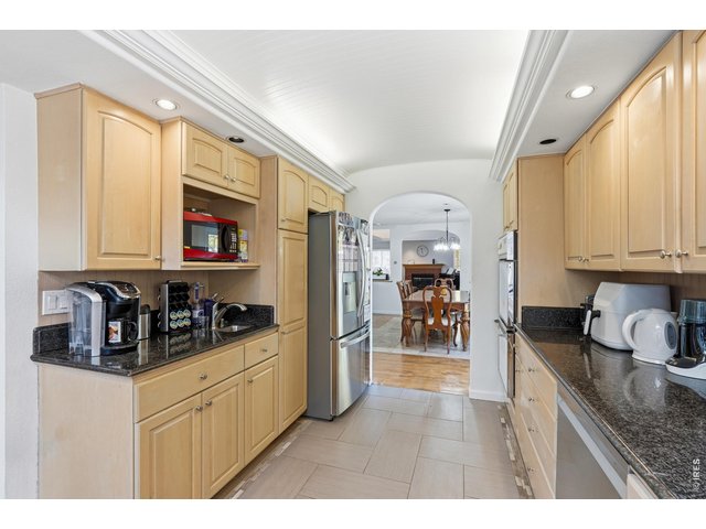 Property Photo 13 Great flow with the dining room into the kitchen. 