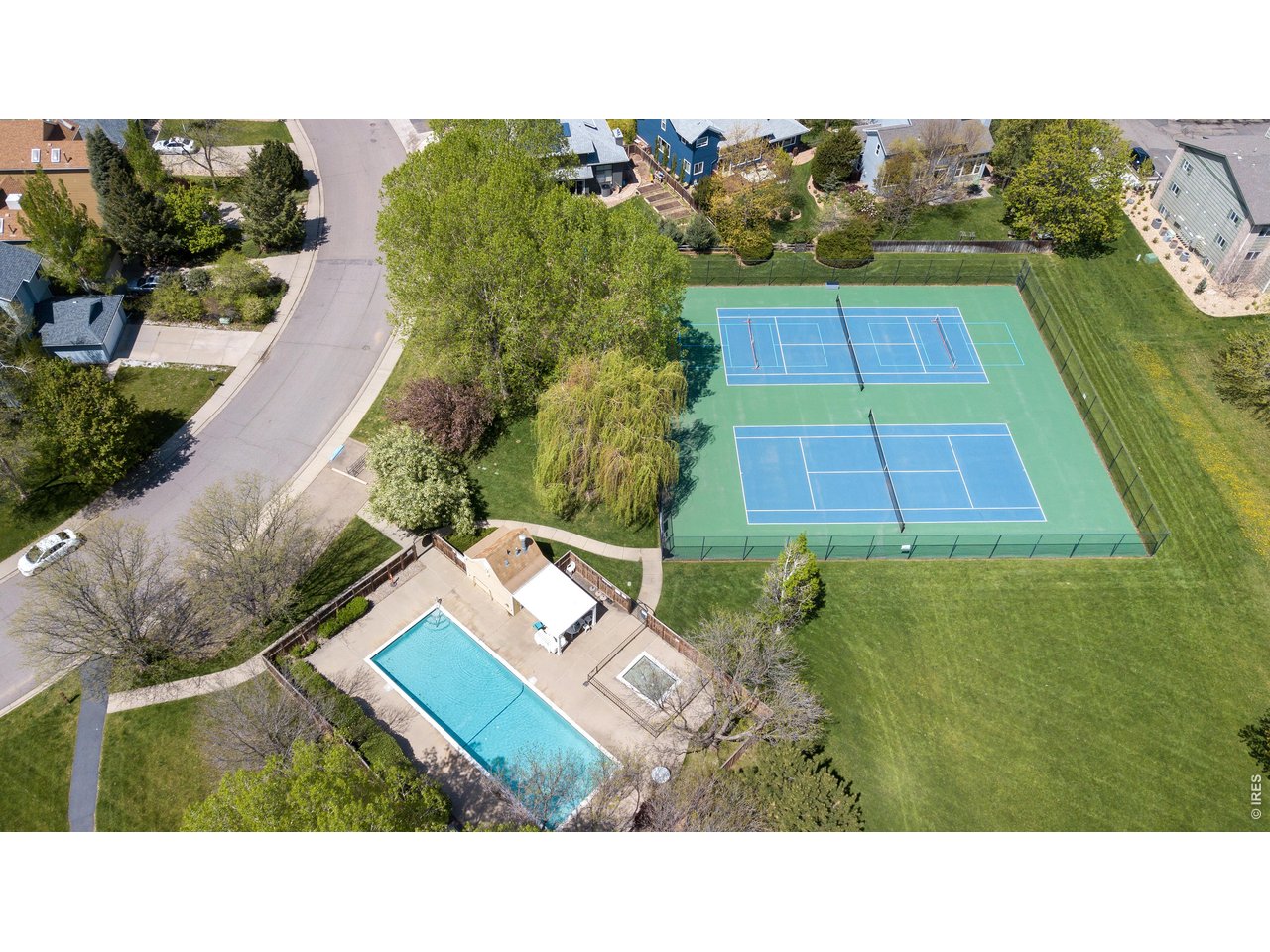 HOA pool, tennis/pickelball courts, and park in the summer