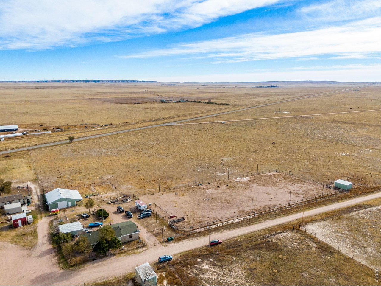 The large pasture has electrical fencing and dwarfs the home and barn area.