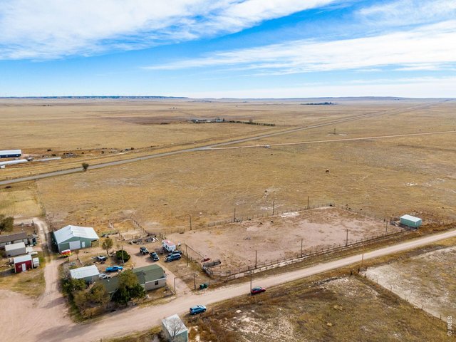Property Photo 35 The large pasture has electrical fencing and dwarfs the home and barn area.