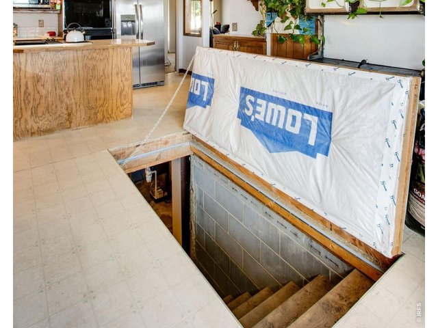 Property Photo 23 Entry to basement from dining room floor