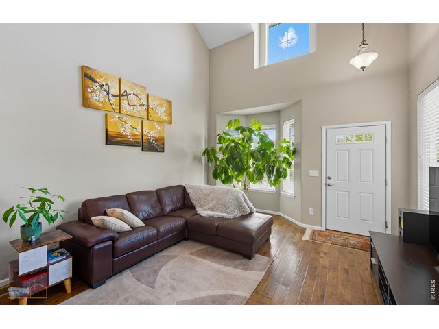 Property Photo 5 Spacious Living Room Features A Two Story Ceiling