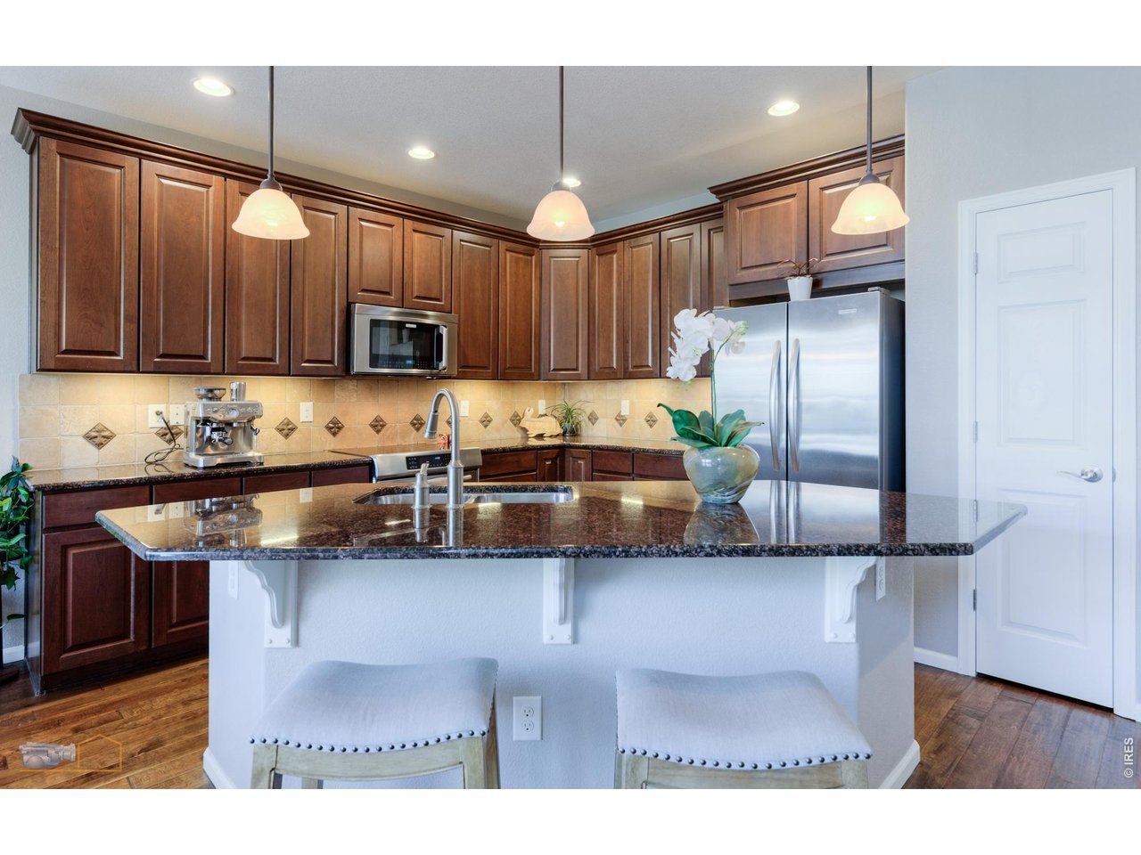 Kitchen Has Great Center Island With Pendant Lighting