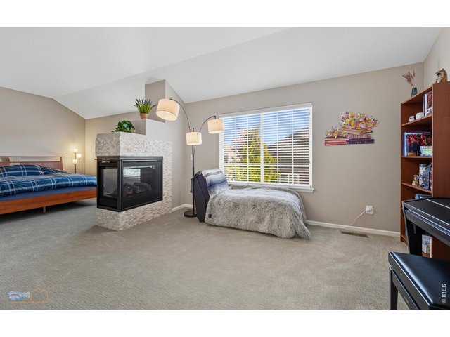 Property Photo 18 Second Floor Features A Spacious Double Sized Primary Bedroom Suite With 3 Sided Fireplace And Vaulted Ceiling