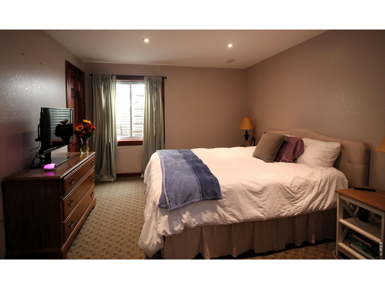 Property Photo 32 Bedroom 4 in basement with egress window.