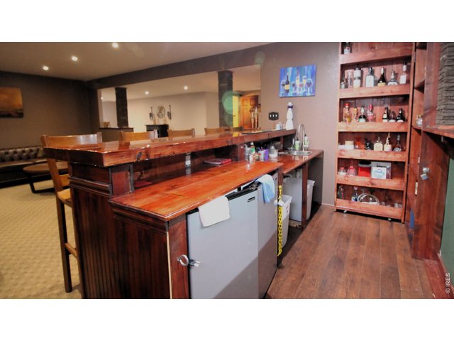 Property Photo 30 Custom bar with lockable liquor cabinet