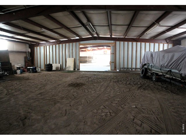 Property Photo 42 South half of shop looking to sliding door.