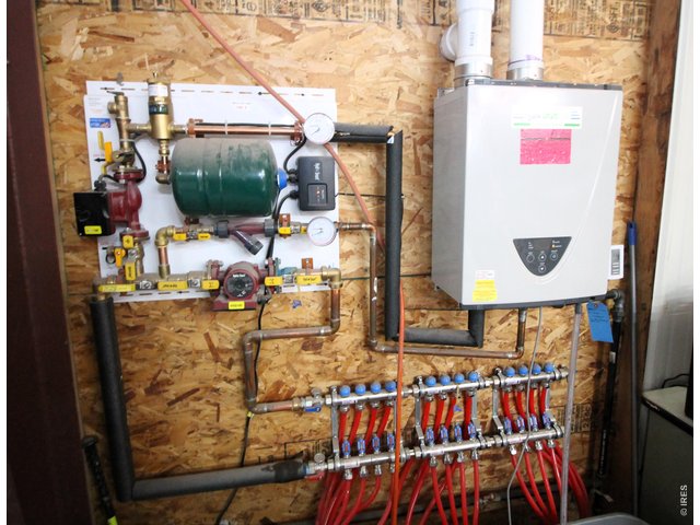 Property Photo 39 In-floor heat system for north half of shop.