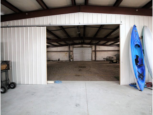 Property Photo 40 Sliding door to south half of shop.