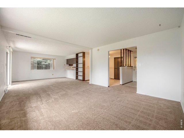 Property Photo 5 Living Room looking toward dining room & kitchen
