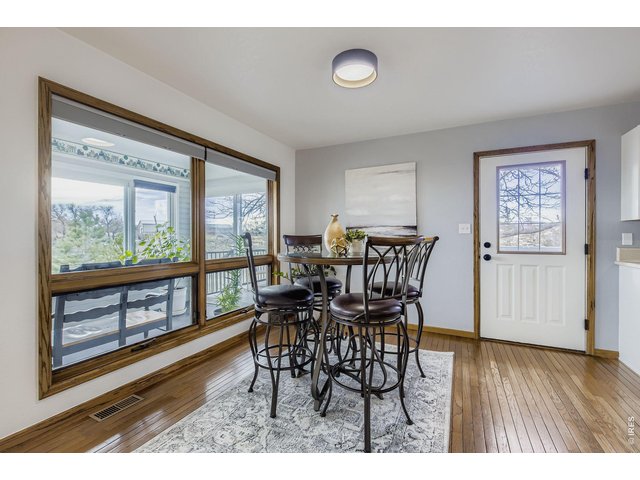 Property Photo 12 Eat-In Dining Room, Enclosed Patio - Main Floor