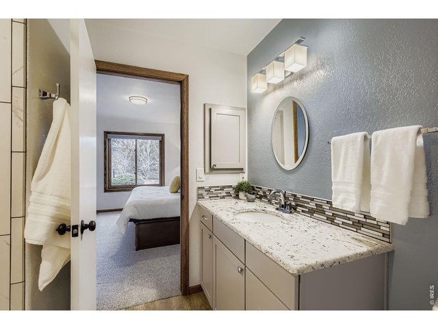 Property Photo 23 Full Bathroom, Bedroom 2 - Main Floor