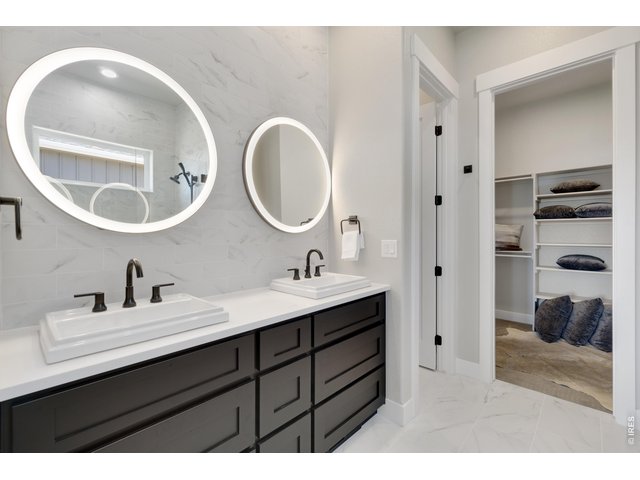 Property Photo 18 Dual Sinks and Lighted Mirrors!