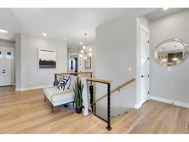 Property Photo 5 Welcoming Entry with Beautiful Engineered Hardwood Flooring