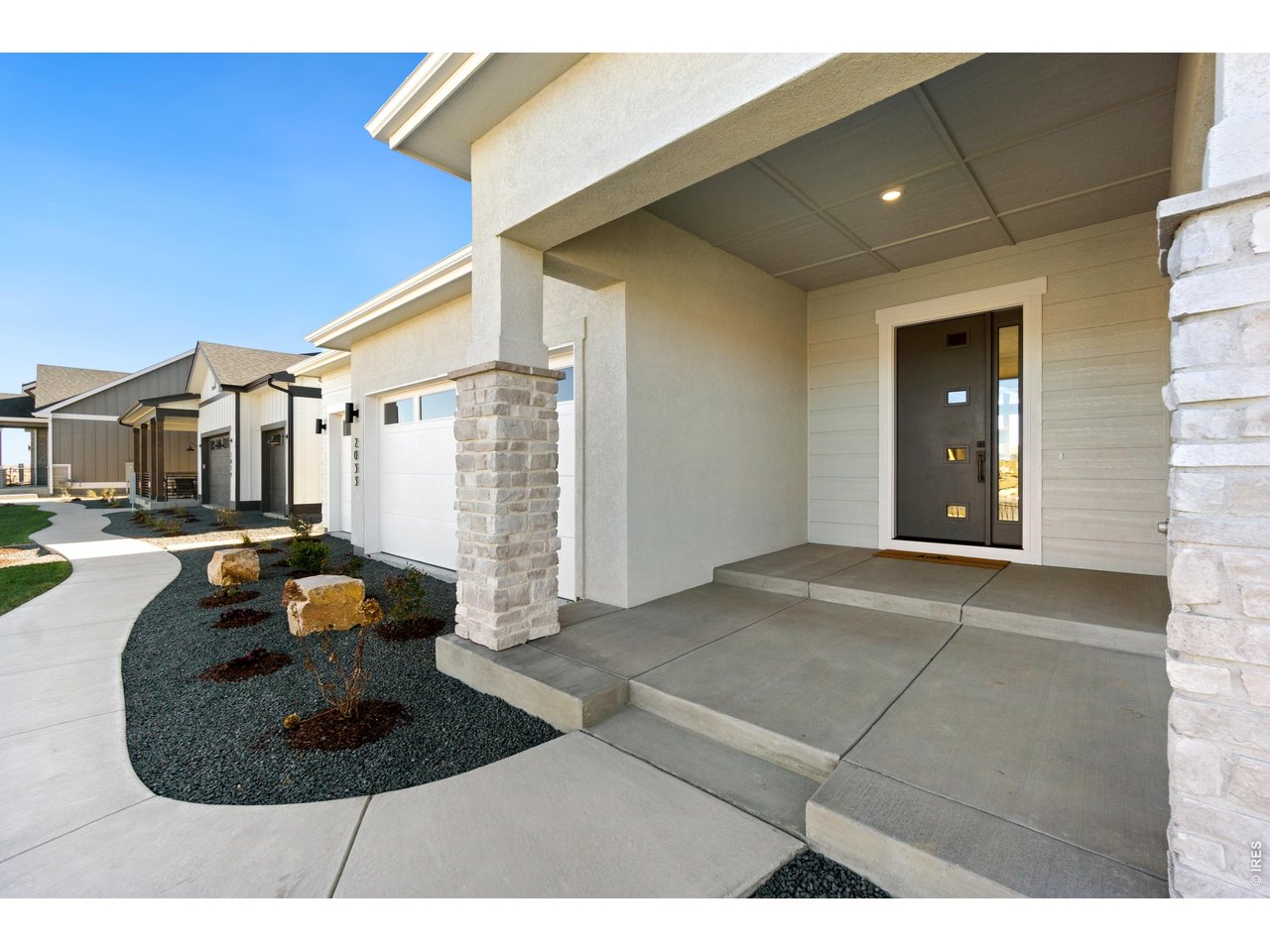 Attached 3-Car Garage and Welcoming Front Porch