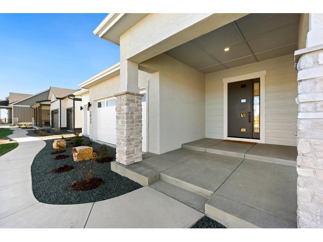 Property Photo 3 Attached 3-Car Garage and Welcoming Front Porch