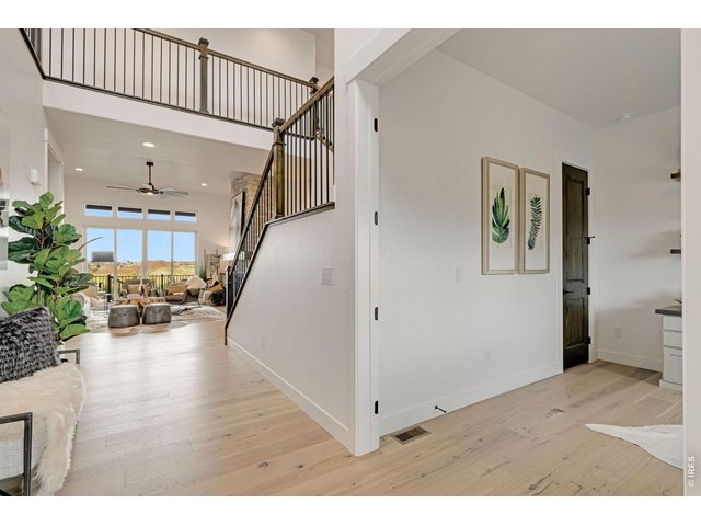 Property Photo 5 Beautiful Entryway with Engineered Hardwood Flooring