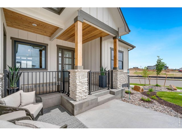 Property Photo 3 Beautiful Front Porch with T&G Entryway