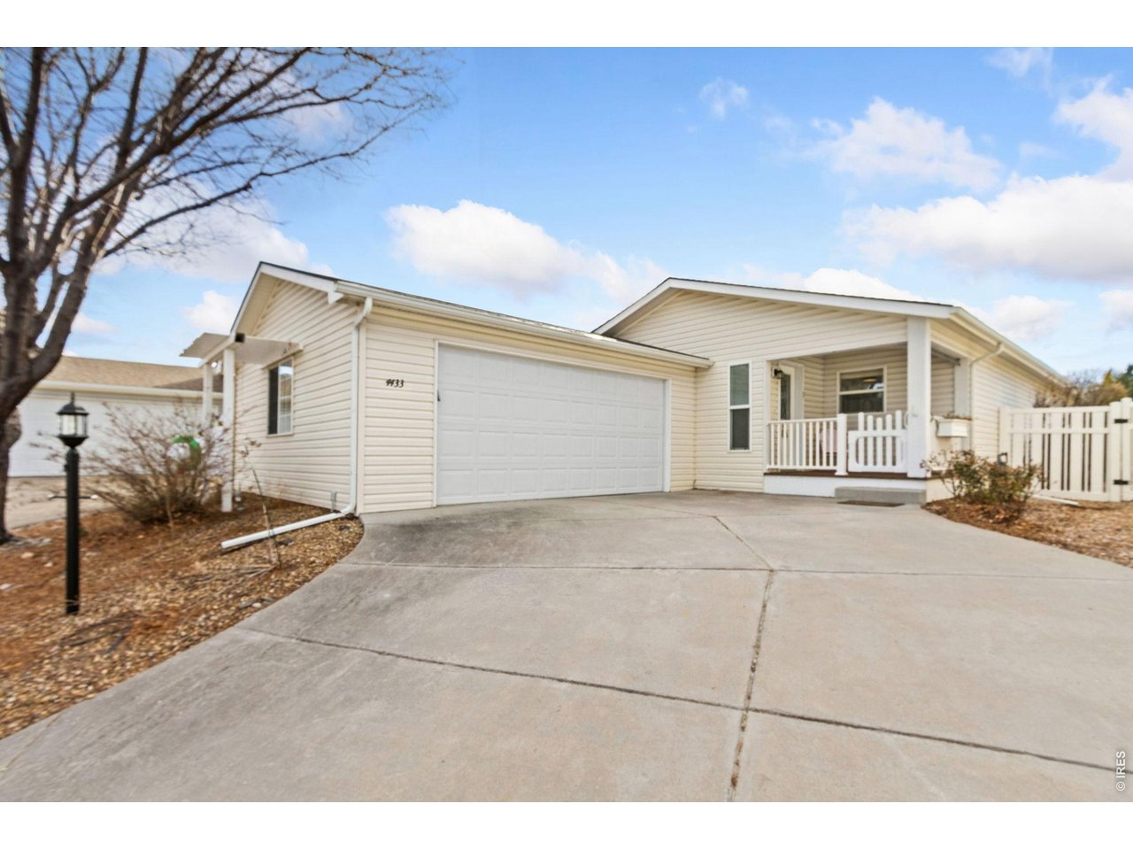 Attached, 2 car garage and cute front porch area. Ramp included in the garage for easy entry.