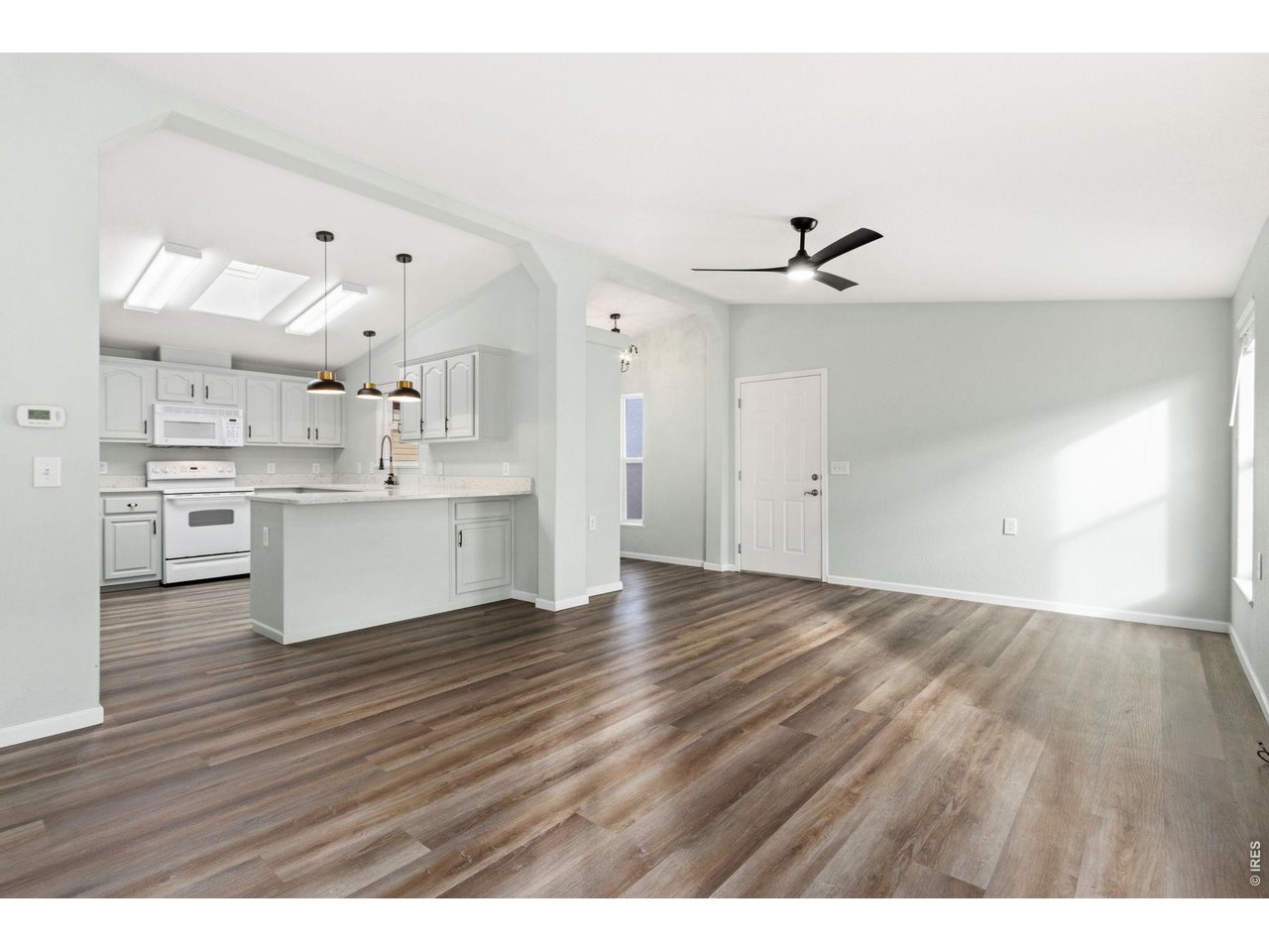 The living room gets lot of natural light from the skylights in the kitchen. 