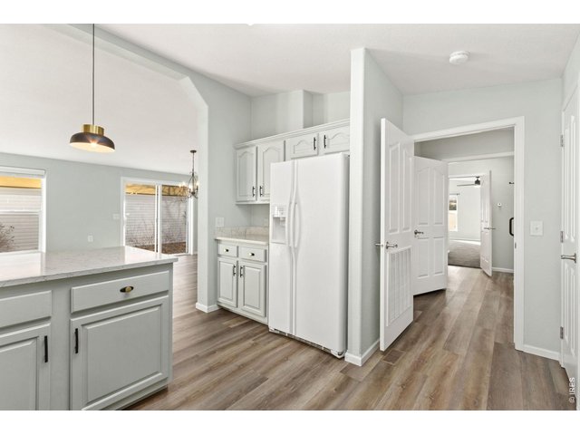 Property Photo 8 Enter your primary bedroom from the kitchen, or go down the hallway. Looped layout. 