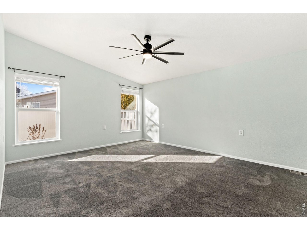 Primary bedroom with plush, updated carpet!
