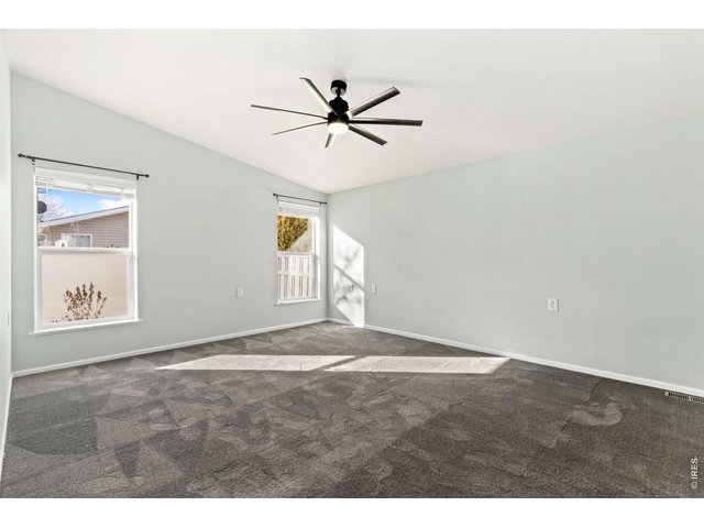 Property Photo 12 Primary bedroom with plush, updated carpet!