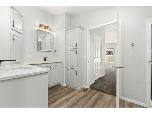 Property Photo 13 Ensuite primary bathroom with double sinks and lots of vanity space. 