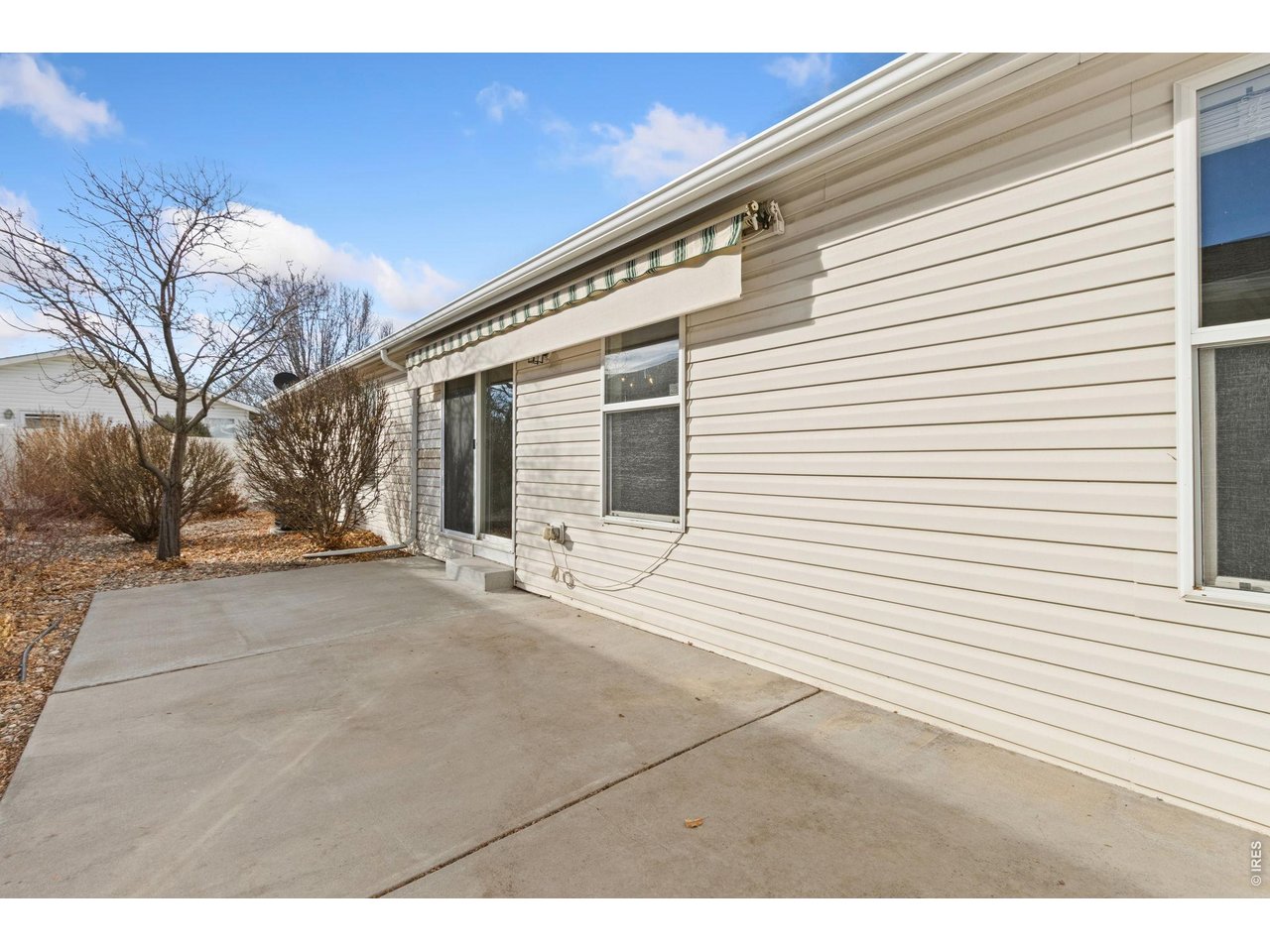 Retractable awning included. Private, fenced in backyard patio space. 