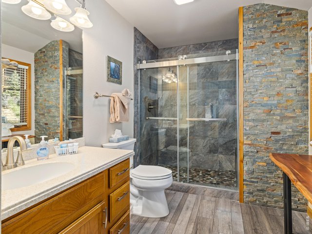 Property Photo 23 Custom tile & stone waterfall shower