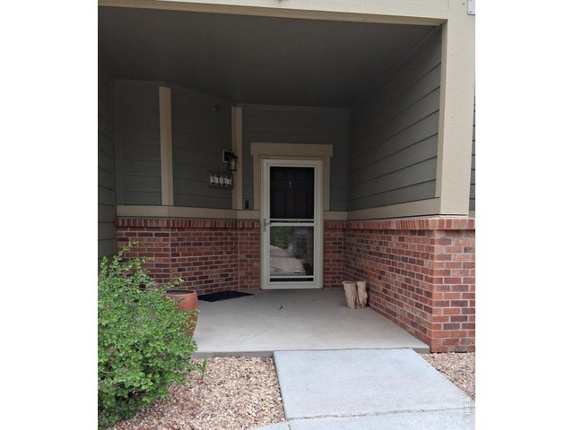 Property Photo 1 Covered front entry with space for lounging...