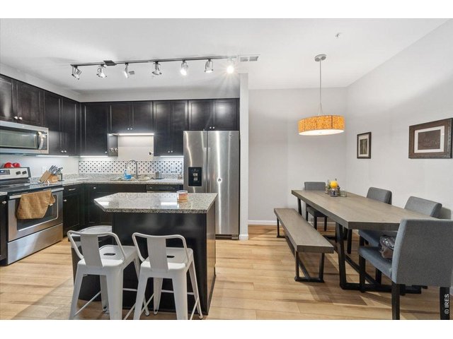 Property Photo 8 Plenty of seating with the kitchen island and dining area