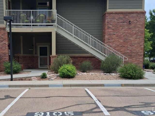 Property Photo 3 Ramp, No stairs into unit. Reserved parking right outside the front door and plenty of visitor parking