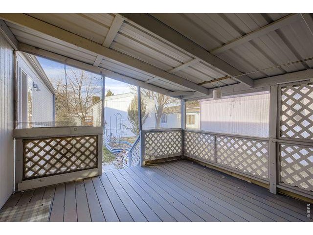 Property Photo 13 Enclosed/Covered Back Deck
