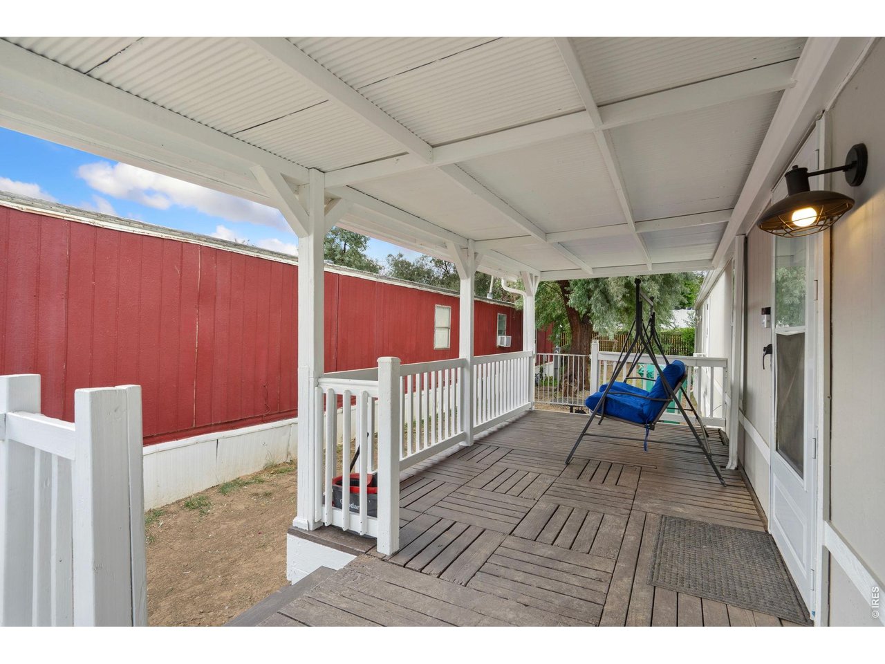 Enjoy your mornings or afternoons is the large enclosed porch!