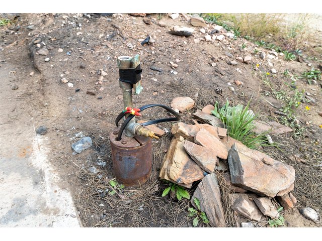 Property Photo 22 High producing well already installed. Was quoted from a well company that this is a 60K value add. Has been inspected and is in great working condition, continuing to draw plenty of water for household use. 