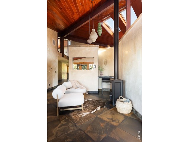 Property Photo 15 Stay cozy by the fire in this kitchen lounge.