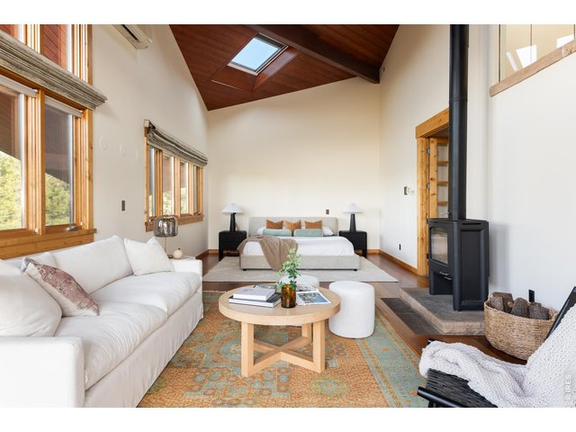 Property Photo 20 Serene and private primary suite retreat with soaring ceilings and walls of windows and a spacious walk-in closet.