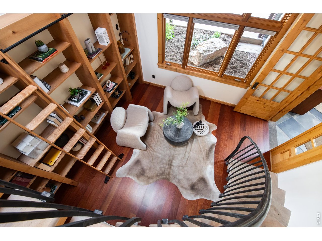 Iron/stone curved stair leads to the artist studio loft. 