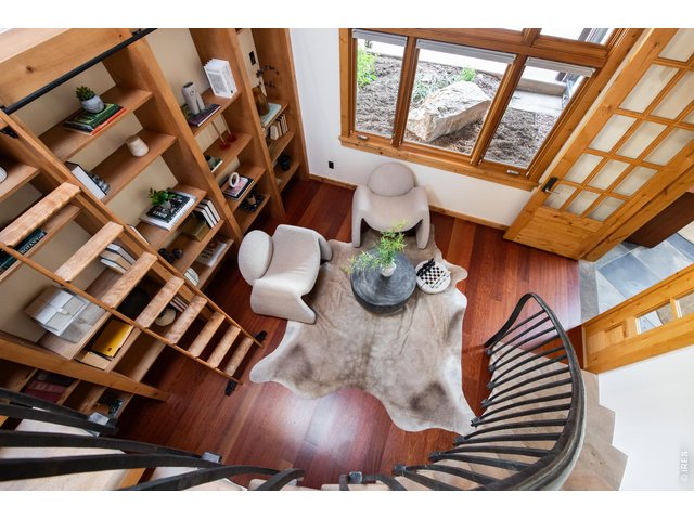 Property Photo 27 Iron/stone curved stair leads to the artist studio loft. 
