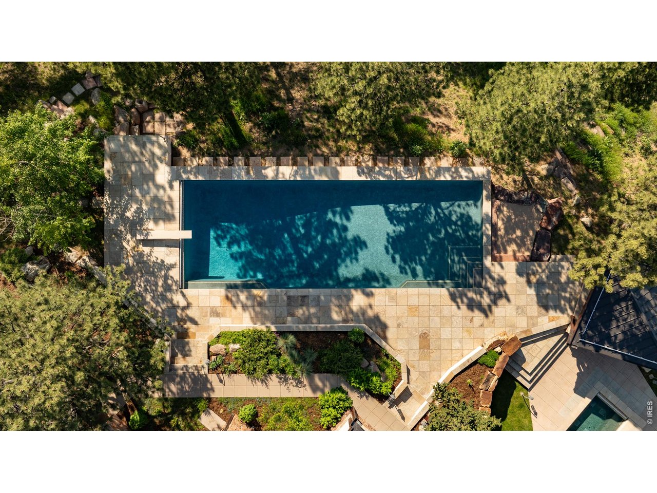 Heated salt-water pool with steps leading down to an eight-person dry sauna and shower.