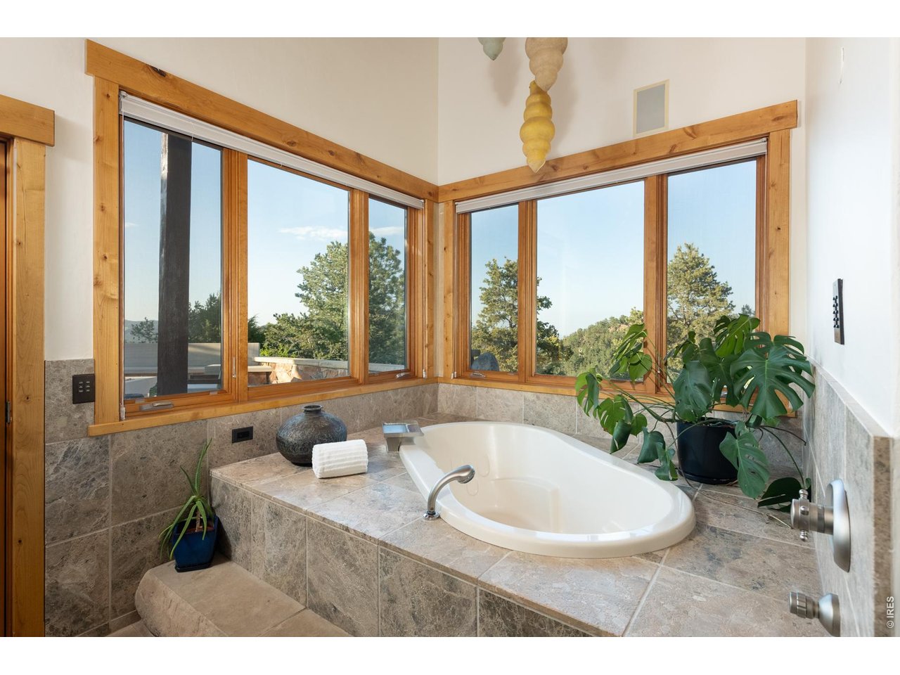 Oversized primary suite soaking tubs with endless views. 