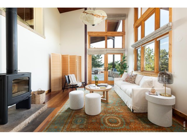 Property Photo 21 A primary suite fireplace sitting room is the perfect place to enjoy slow mornings and evenings.